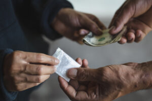 Drugs and cash exchanging hands